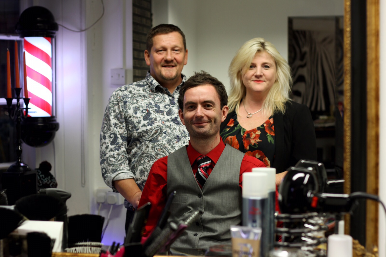 The Penny Black team beside the barber pole